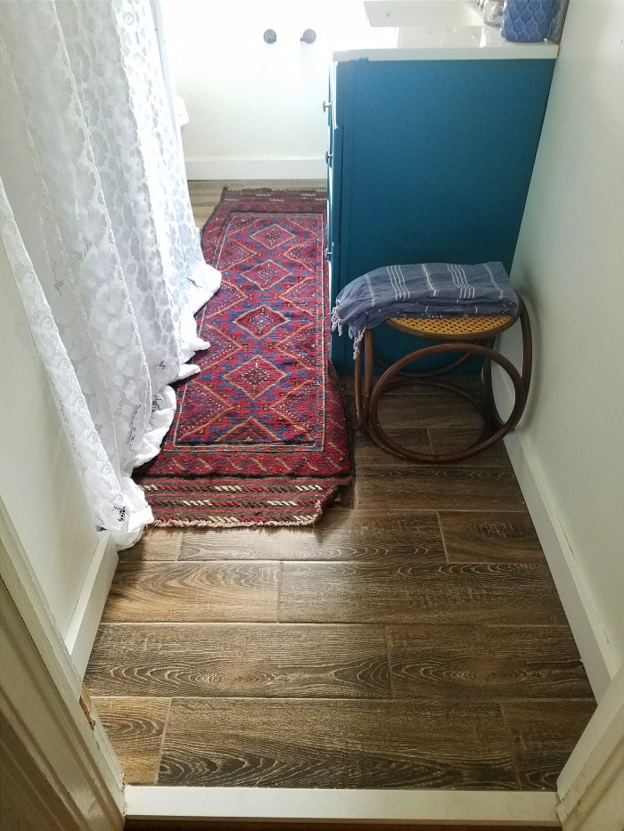 The floors in my vintage bohemian bathroom